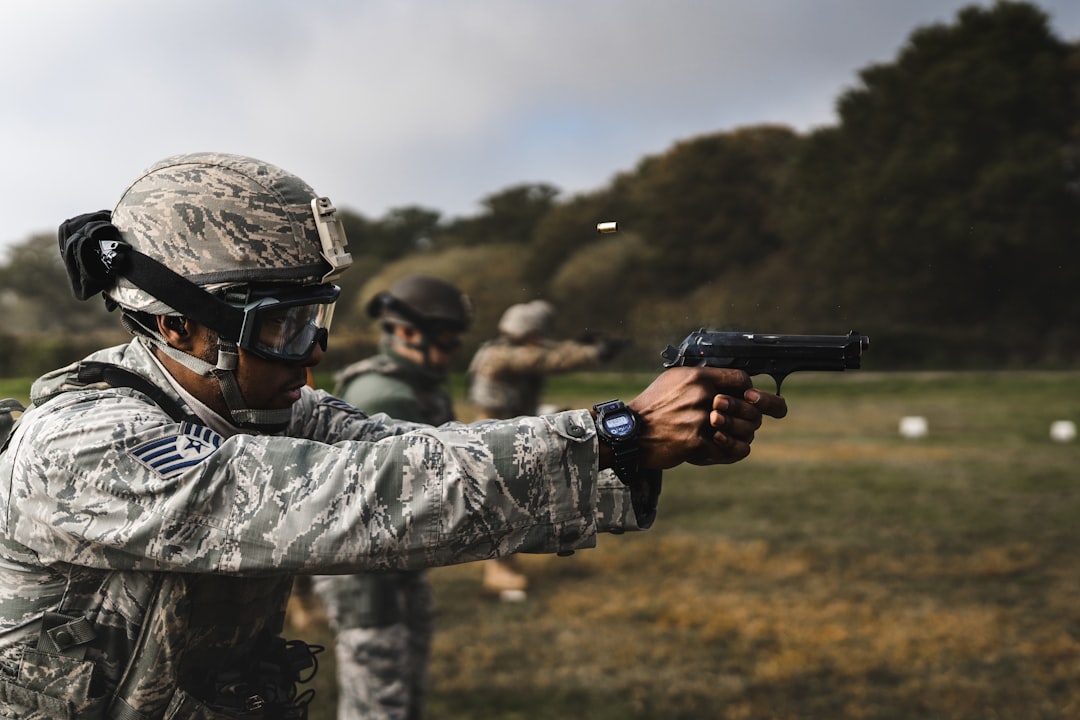 Soldiers practice shooting guns at a firing range.
